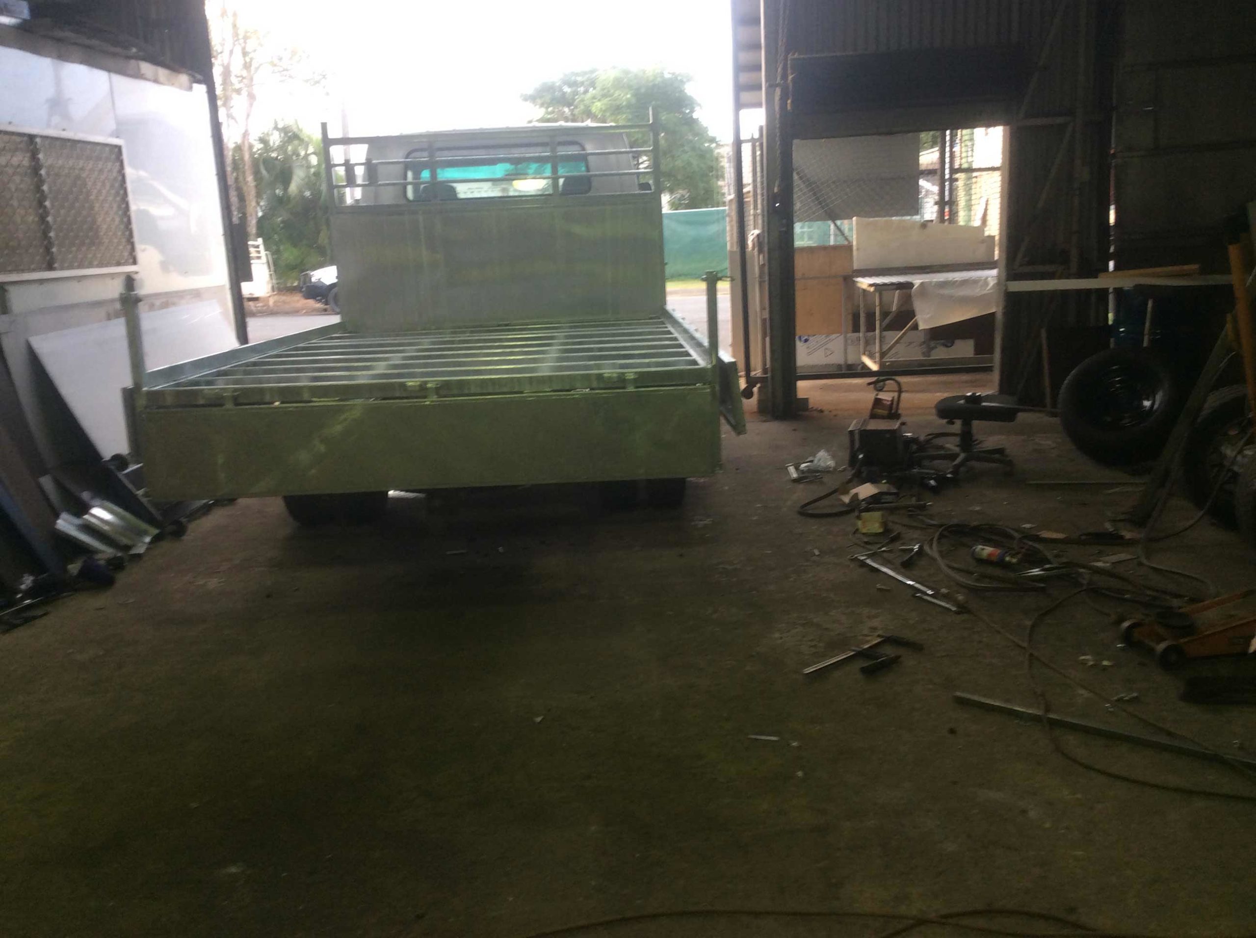 Rear View of a Silver Truck in a Shop — Trailers and Truck Bodies in